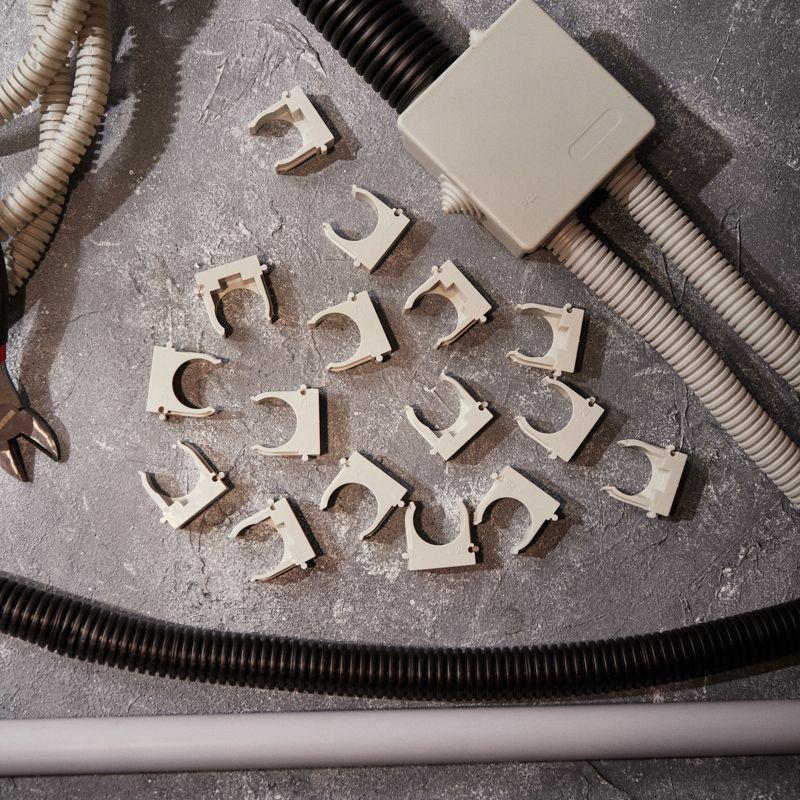 Держатель для труб (клипса) d25мм для монтажного пистолета сер. Rexant 28-0425-1