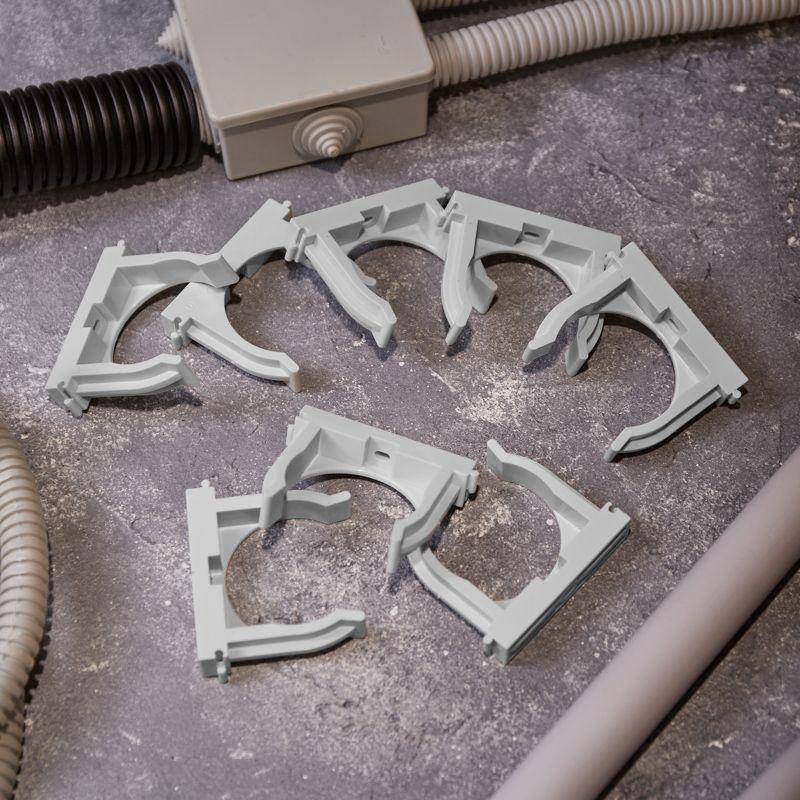 Держатель для труб (клипса) d50мм для монтажного пистолета сер. Rexant 28-0450-1