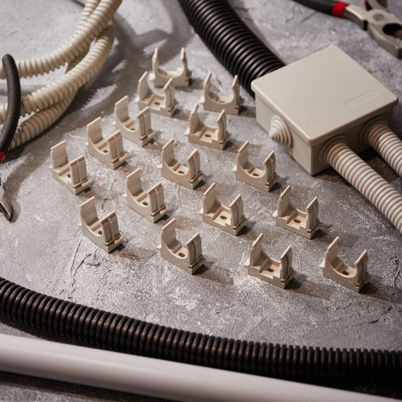 Держатель для труб (клипса) d25мм для монтажного пистолета сер. Rexant 28-0425-1